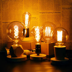 Vintage-style light bulbs on a wooden surface 
