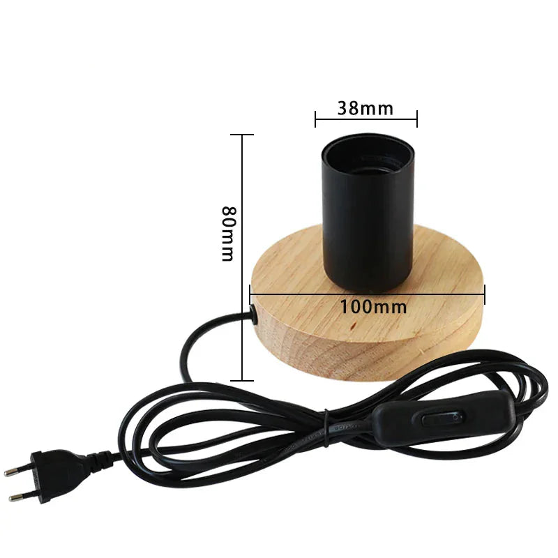Measurement chart of a black cylindrical light fixture on a wooden base 